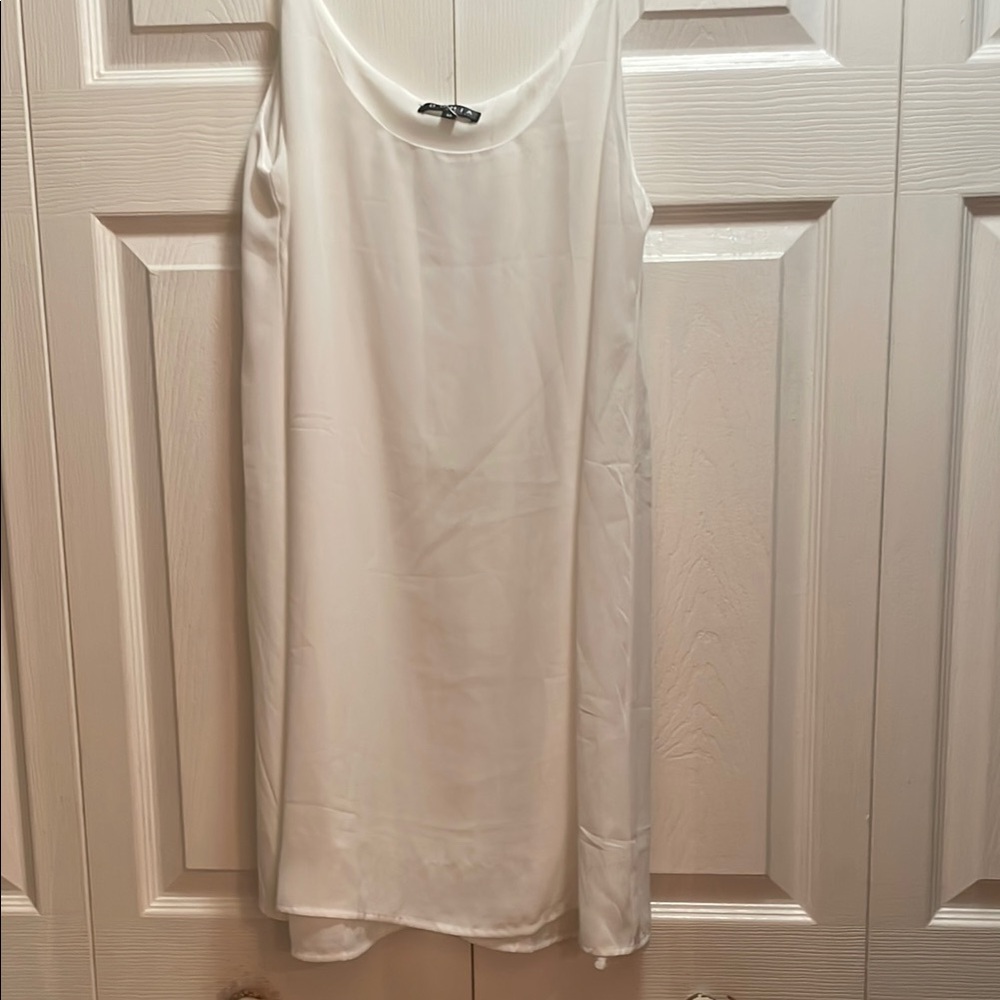 Elegant White Sleeveless top can wear as little dress 100/ percent polyester